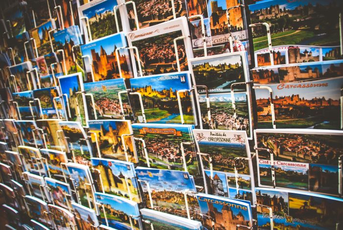 wall of diverse, colourful postcards